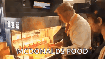 Man Standing In Front Of McDonald's Food Display GIF