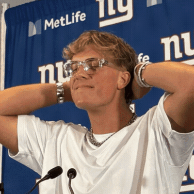 Man Standing In Front Of MetLife Sign GIF