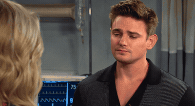 Man Standing In Front Of Monitor Showing 75 GIF