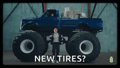 Man Standing In Front Of Monster Truck Saying New Tires GIF