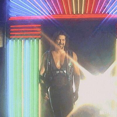 Man Standing In Front Of Netflix Neon Sign GIF