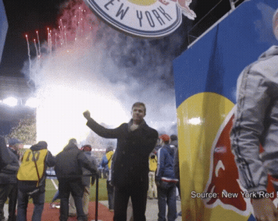 Man Standing In Front Of New York Sign GIF