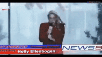 Man Standing In Front Of News Banner GIF