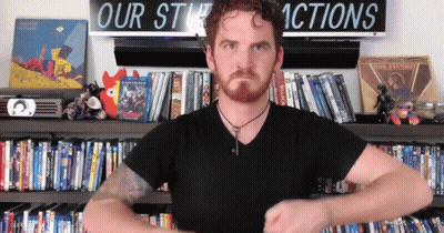 Man Standing In Front Of Our Stuck Actions Sign GIF