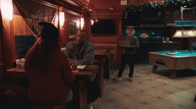 Man Standing In Front Of Pool Table With Menu GIF