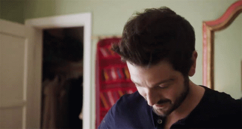 Man Standing In Front Of Poster Saying HH GIF