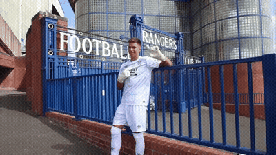 Man Standing In Front Of Rangers Sign GIF