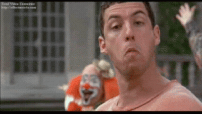 Man Standing In Front Of Red Face Clown GIF