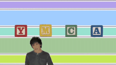 Man Standing In Front Of Robots With YMCA GIF