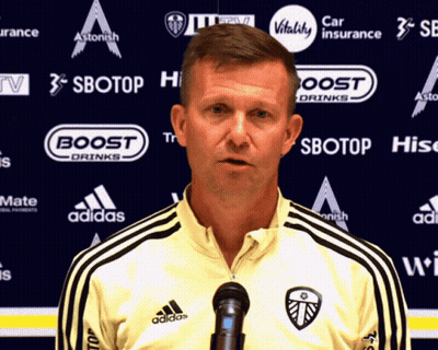 Man Standing In Front Of Sbotop Sign GIF