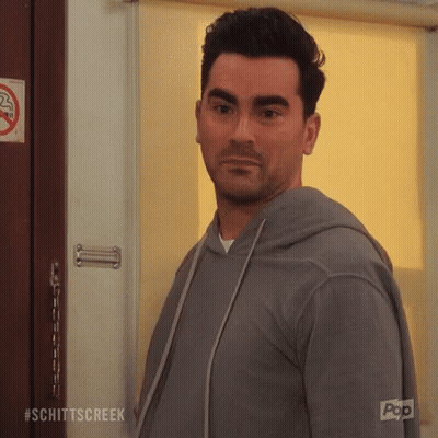 Man Standing In Front Of #Schittscreek Door GIF