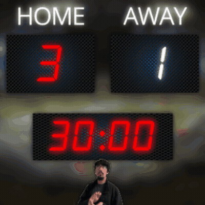 Man Standing In Front Of Scoreboard GIF