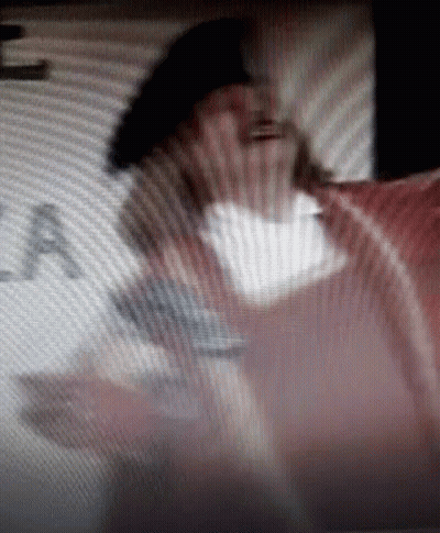 Man Standing In Front Of Sign GIF