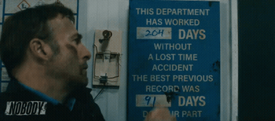 Man Standing In Front Of Sign This Department Has Worked 204 Days GIF