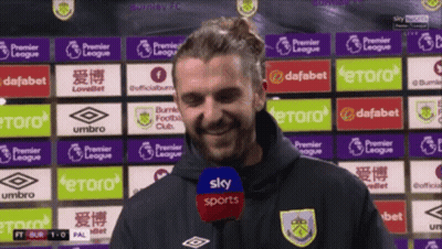 Man Standing In Front Of Sky Sports Ads GIF