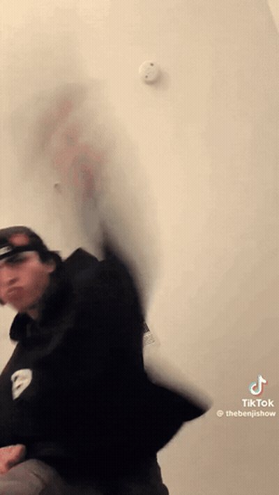 Man Standing In Front Of Smoke Detector GIF