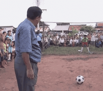 Man Standing In Front Of Soccer Ball GIF