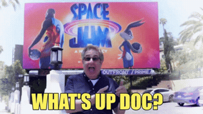 Man Standing In Front Of Space Jam Billboard GIF