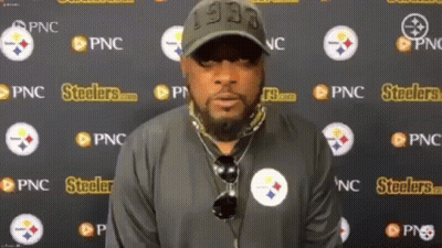 Man Standing In Front Of Steelers Wall GIF