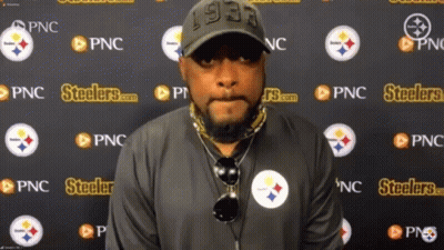 Man Standing In Front Of Steelers Wall GIF