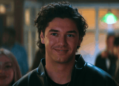 Man Standing In Front Of Stell Sign GIF