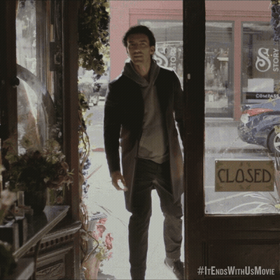 Man Standing In Front Of Store With Closed Sign GIF