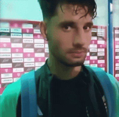 Man Standing In Front Of T-Mobile Wall GIF