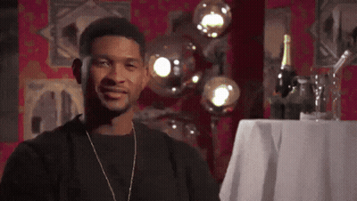 Man Standing In Front Of Table With Wine Bottle GIF