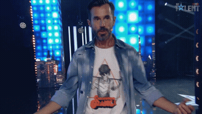 Man Standing In Front Of Talent Screen GIF
