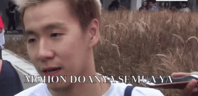 Man Standing In Front Of Tall Grass GIF