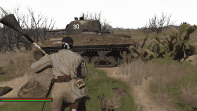 Man Standing In Front Of Tank Number 30 GIF
