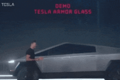 Man Standing In Front Of Tesla GIF