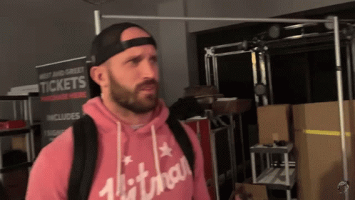 Man Standing In Front Of Tickets Sign GIF