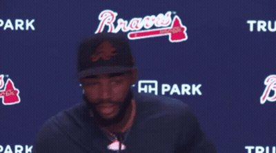 Man Standing In Front Of Trust HH Park Sign GIF