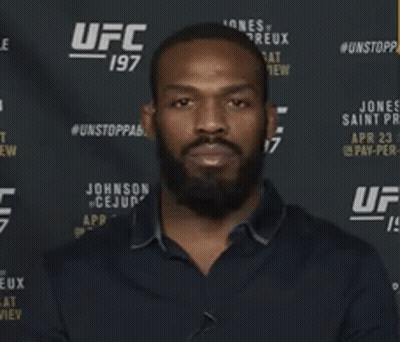 Man Standing In Front Of UFC 197 Banner GIF