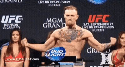 Man Standing In Front Of UFC Sign GIF