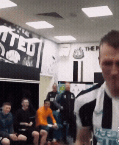 Man Standing In Front Of United Sign GIF