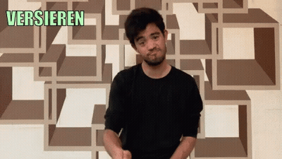 Man Standing In Front Of Versieren Wall GIF
