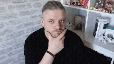 Man Standing In Front Of Videomic 25 Box GIF