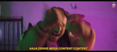 Man Standing In Front Of Wall Saying Aaja Dekhe Mera Content GIF