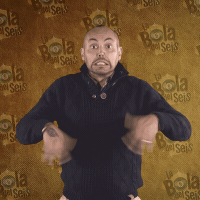Man Standing In Front Of Wall Saying Bola GIF