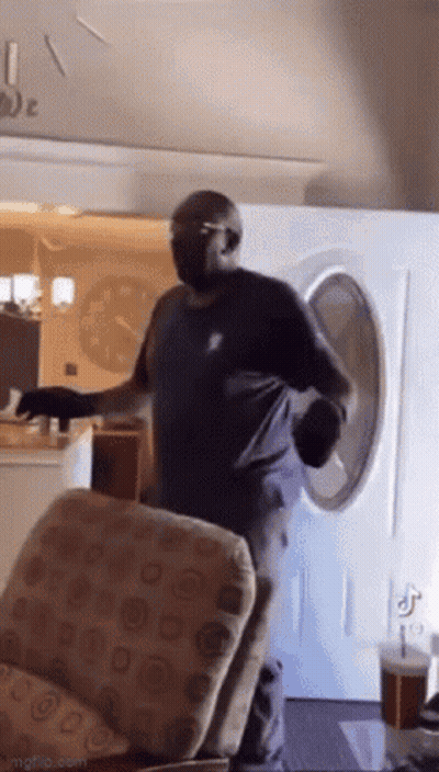 Man Standing In Front Of Washing Machine GIF