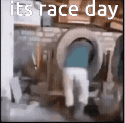 Man Standing In Front Of Washing Machine With Race Day GIF