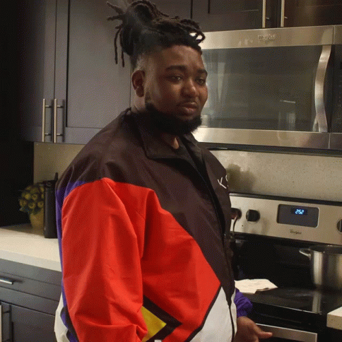 Man Standing In Front Of Whirlpool Stove GIF