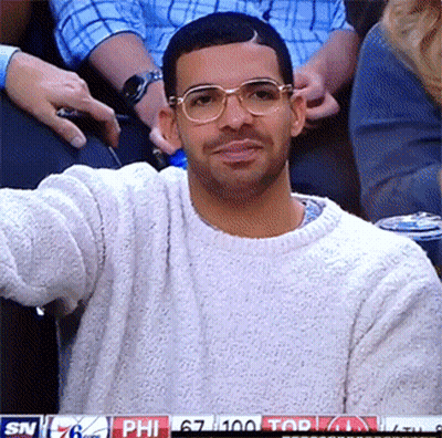 Man Standing In Front Of White Wall With Smoke Detector GIF