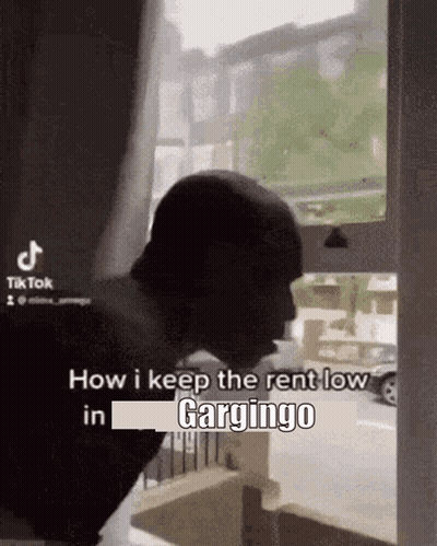 Man Standing in Front of Window
