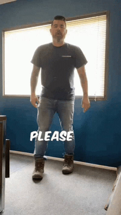 Man Standing In Front Of Window Saying Please GIF