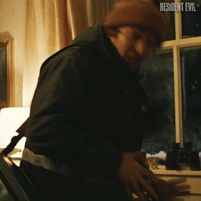 Man Standing In Front Of Window With Resident Evil GIF