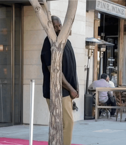 Man Standing In Front Of Wine Shop GIF