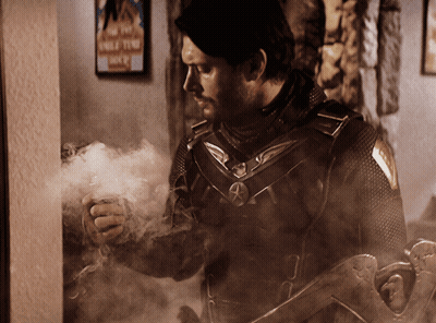 Man Standing In Front Of Wolf Tent Sign GIF